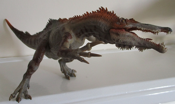 Papo Baryonyx propped against wall