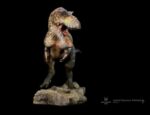 Daspletosaurus dinosaur statue on a base