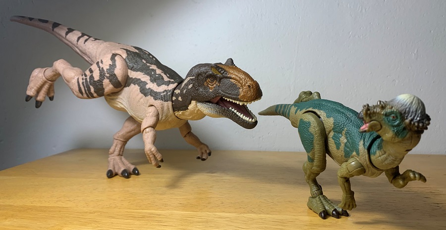 Hammond Collection Pachycephalosaurus, being chased by predator.