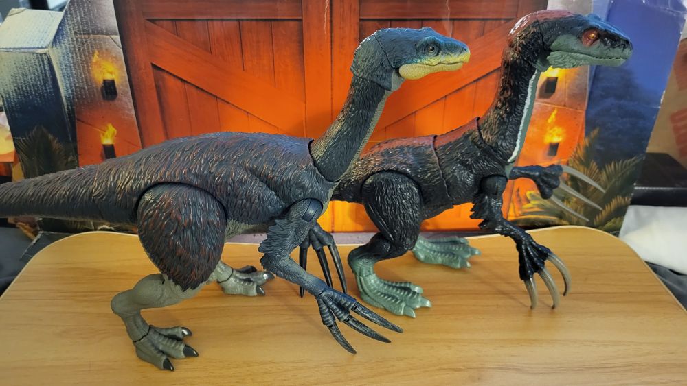 Therizinosaurus facing towards the right, side view, in standing pose, standing next to the Dominion Therizinosaurus